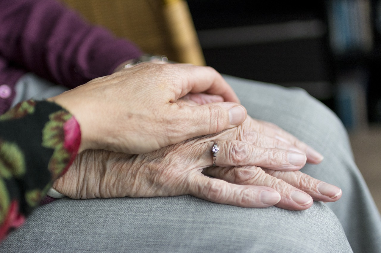 Seniors holding hands