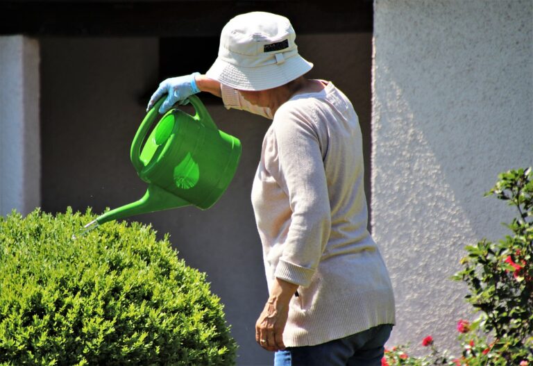 Senior watering plants