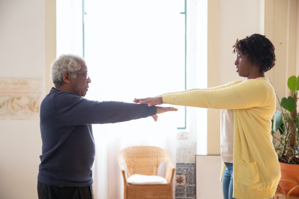 caregiver helping with exercise program